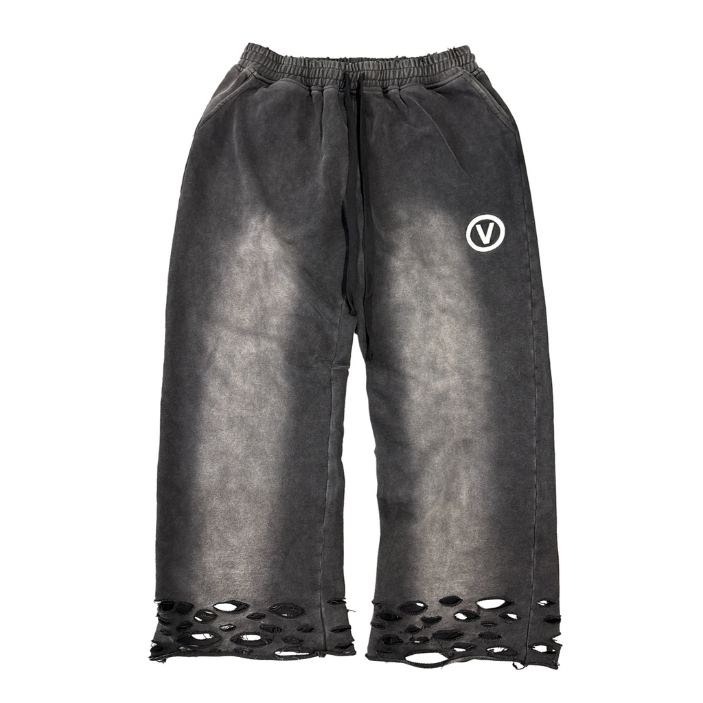 Distressed black pants with a logo on a white background